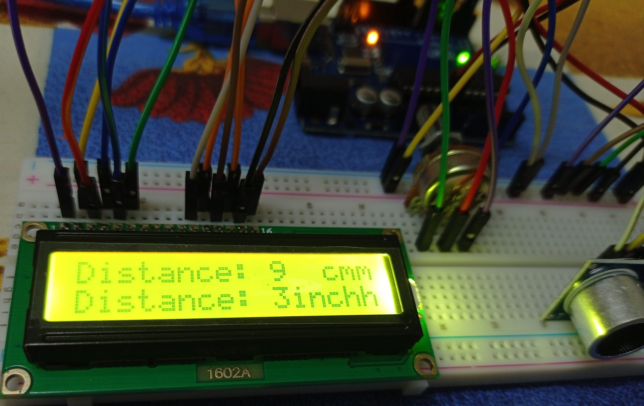 Display Distance out on LCD with Arduino Uno - Prgmine